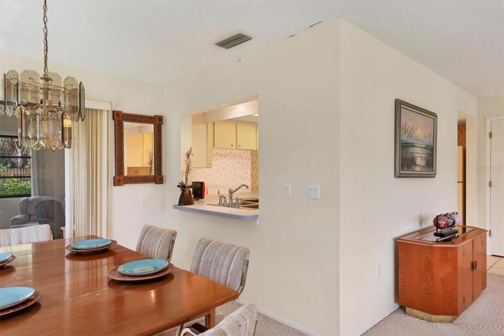 Dining room with a look into kitchen area