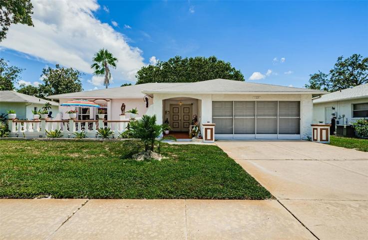 Front of Home w/ screened 2 car garage