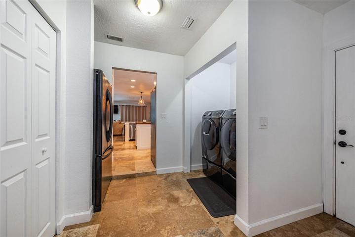 Laundry Room with side door access.