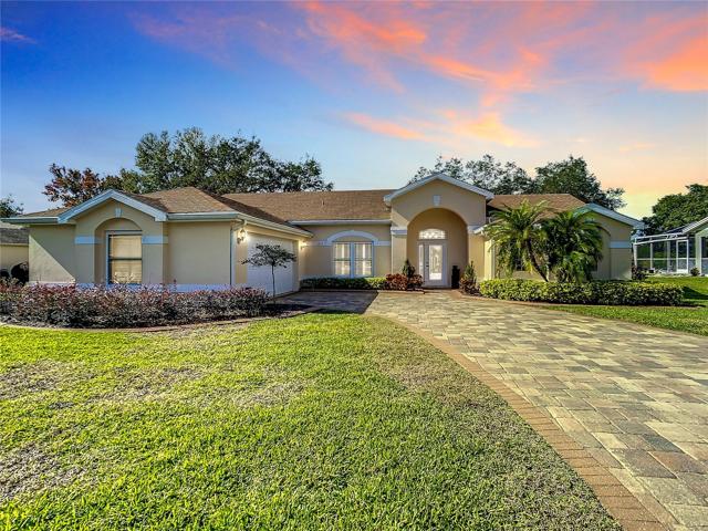 This STUNNING CUSTOM-BUILT HOME in Oakwood Golf Club subdivision.