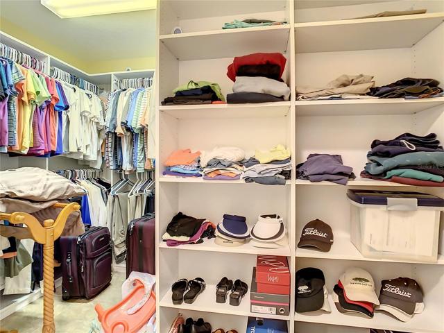 1 walk-in closet with California style shelving.  The closet on the opposite side of the hallway is a standard closet.