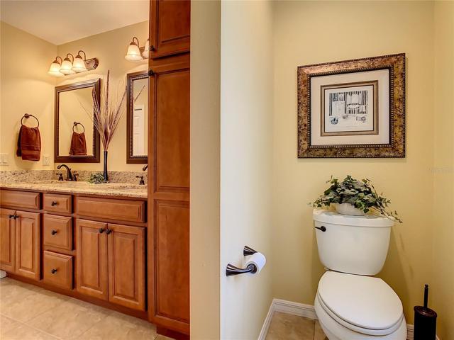 Water closet and vanity are on the opposite wall from the walk-in shower.