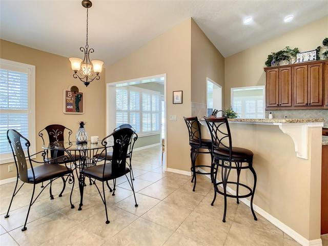 Dinette area is just off the kitchen and breakfast bar.