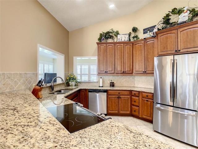 Granite countertop and breakfast bar area.