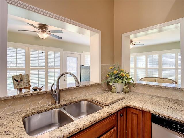 Kitchen sink area opens to the office area.