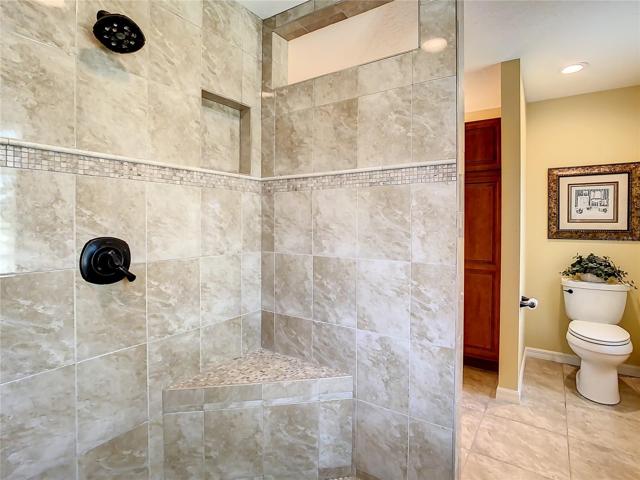 Walk-in shower is designed without a door  - so no door to have to keep clean.