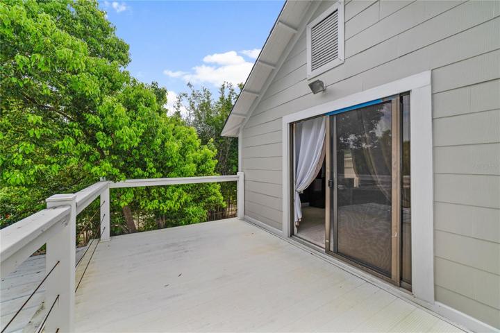 Balcony off the primary bedroom is the perfect place to enjoy your morning coffee!