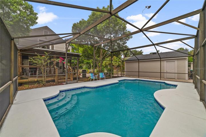 The SCREENED POOL is a staple in Florida and this one was recently resurfaced and the enclosure re-screened!