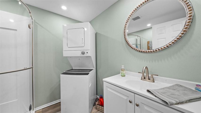Spare bathroom with laundry inside