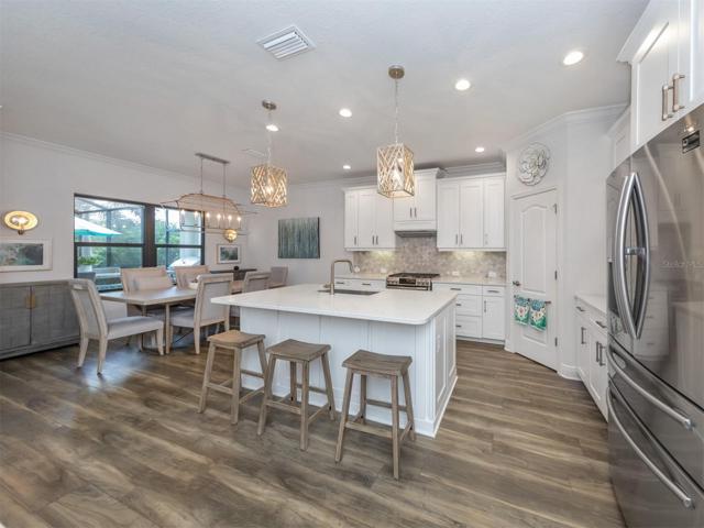 Spacious Kitchen with Natural Light and Pool views