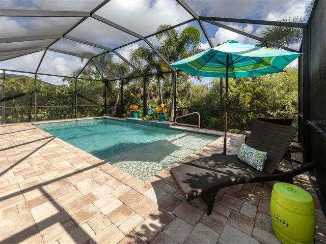 Travertine Deck Adds To The Beauty of Pool Area
