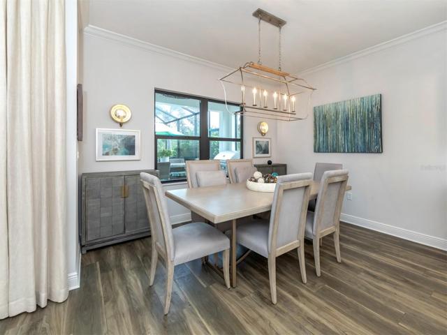 Formal Dining Space Over Looking Pool and Backyard