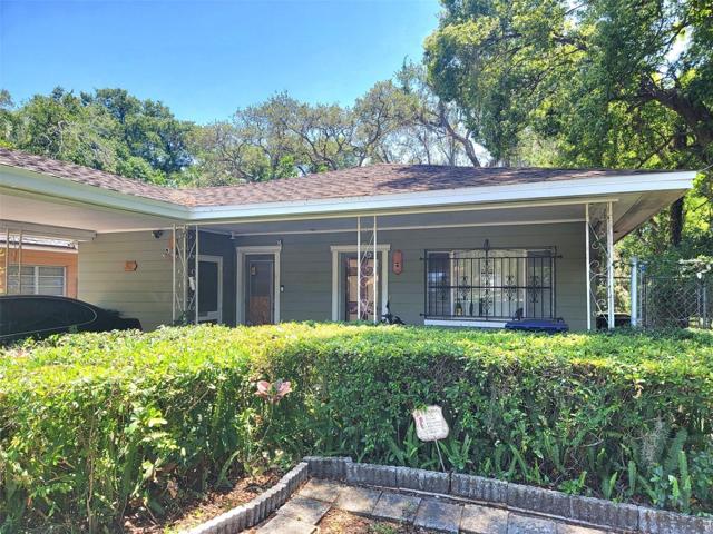 Front of House with mature landscaping