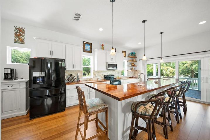Kitchen opens onto large upper deck