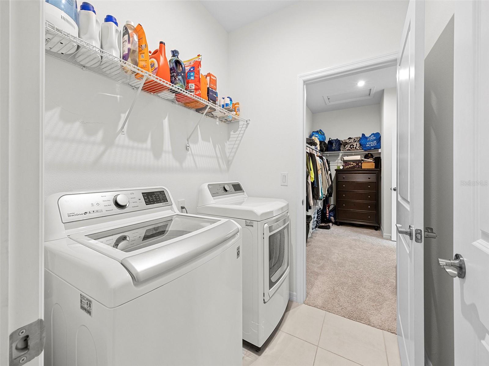 Laundry room located next to Walk-in closet