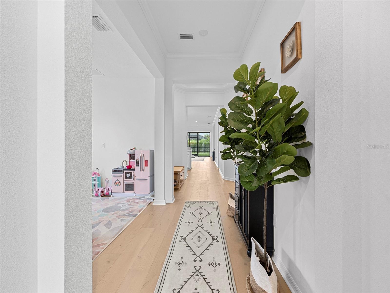 Looking from Front door toward den/office/playroom/flex space