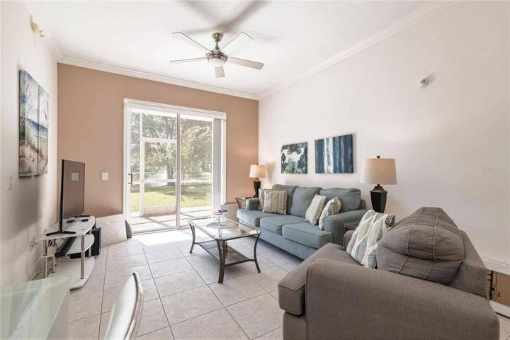 Living room and sliding glass doors to pond.