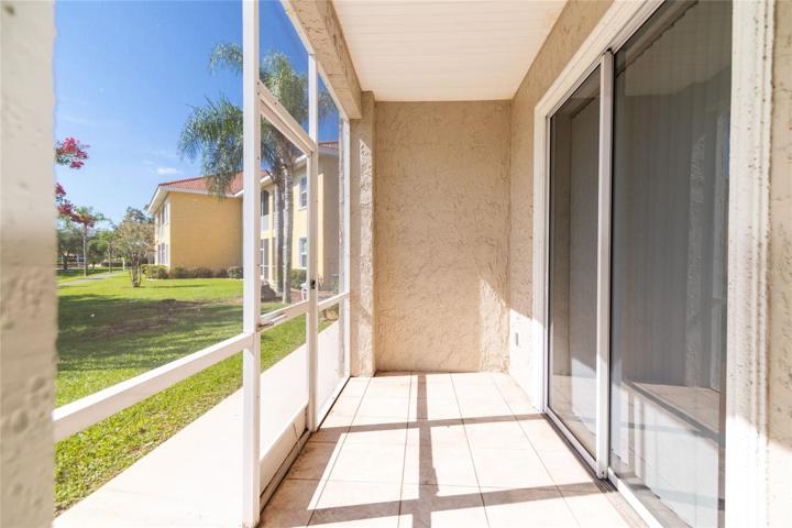 Lanai with ceramic tile floor. Bedroom entrance