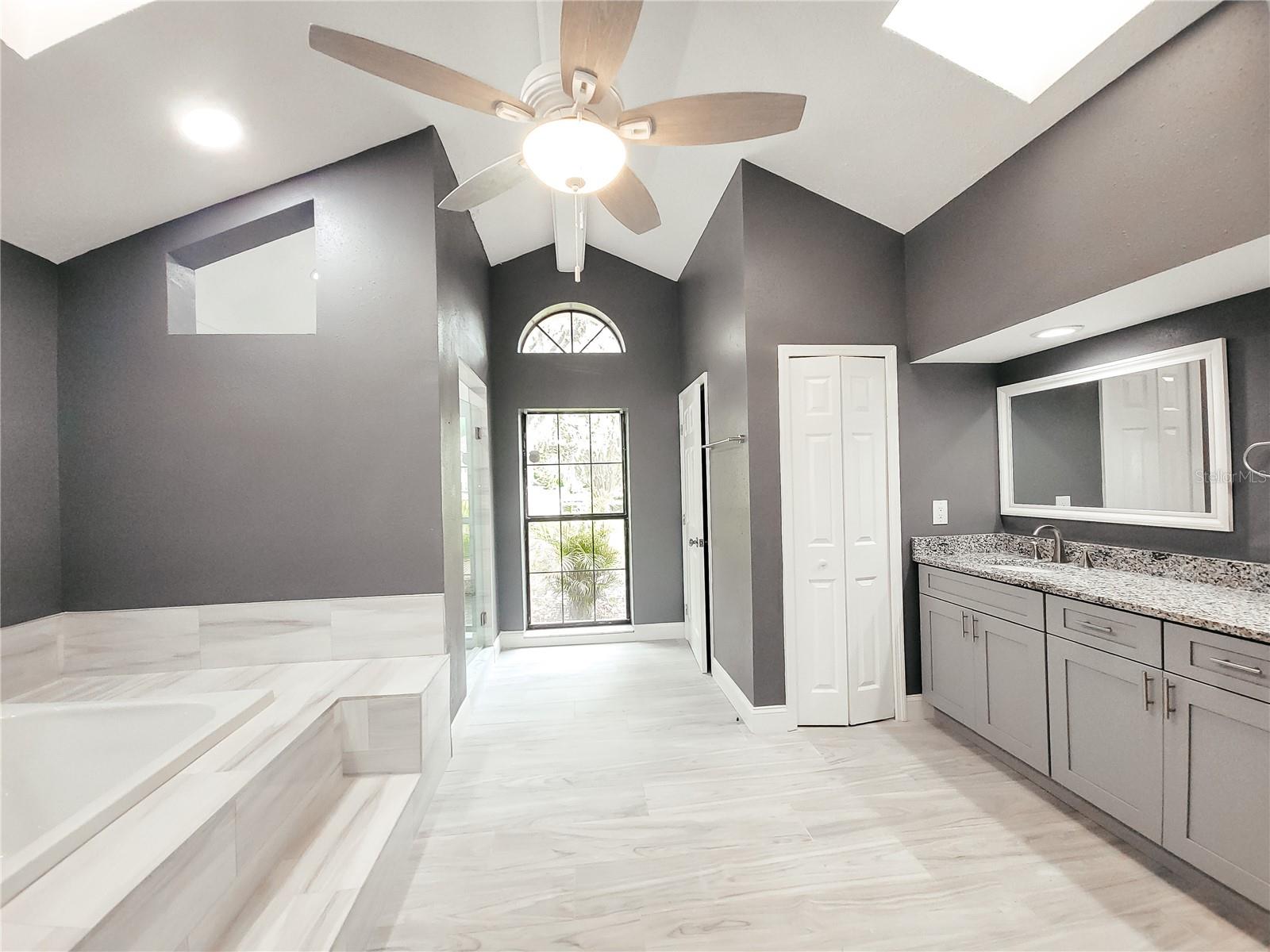 featuring a sunken tub that overlooks your own private garden