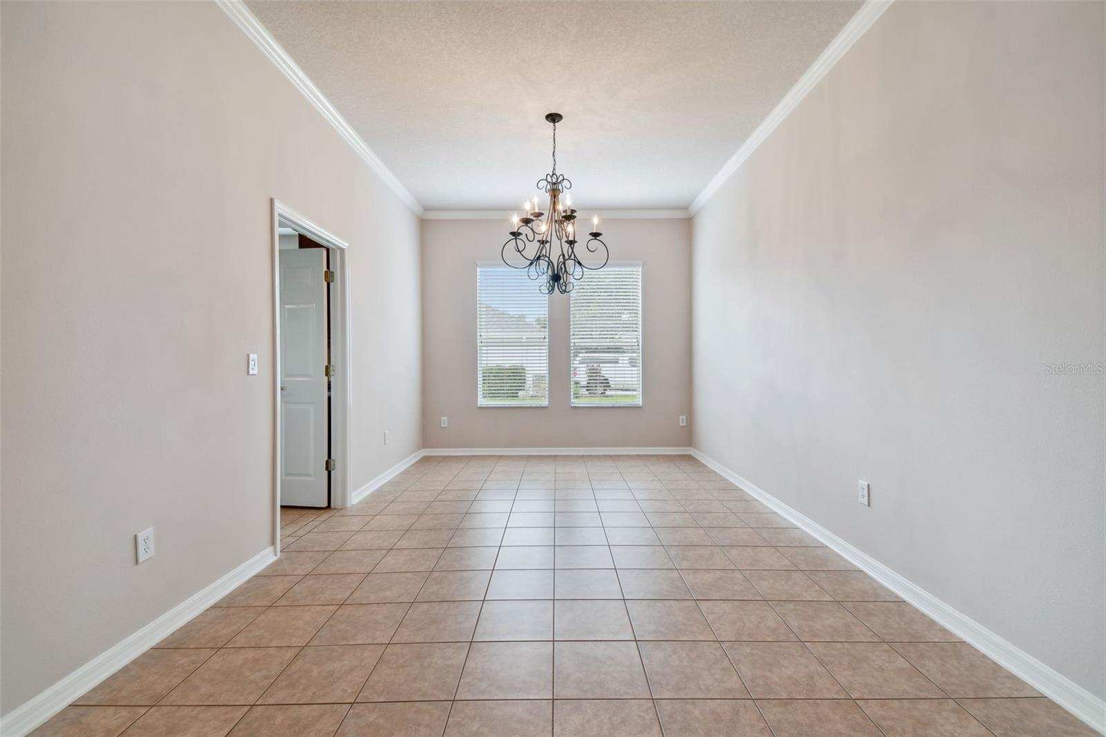 Dining area with double doors that give access to the kitchen
