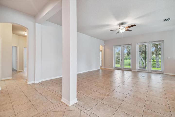 HUGE family room with 2 sets of french doors that lead to the porch