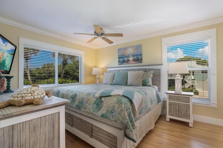 Light and bright primary bedroom with king bed
