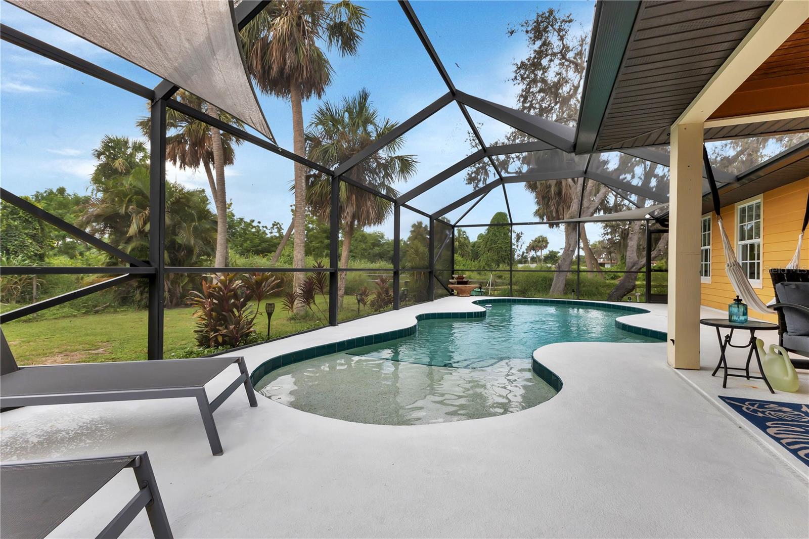 Nature encompasses the private pool setting