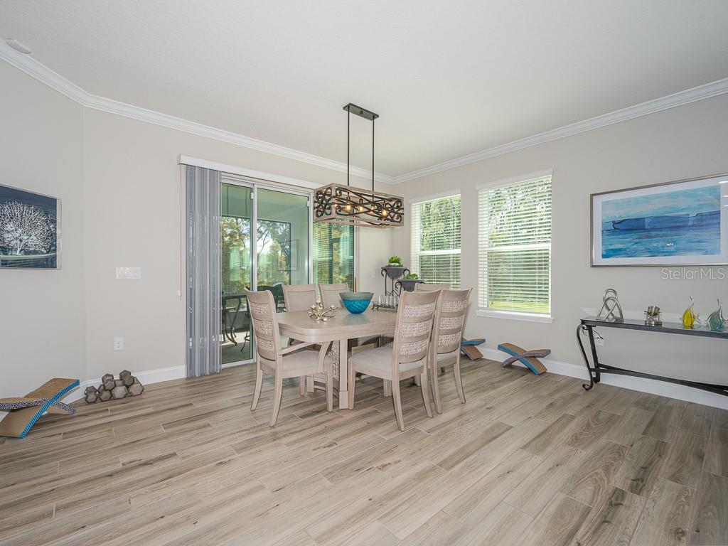 Dining room open to kitchen and living room. The adjacent den/office would also make a fabulous separate dining room.