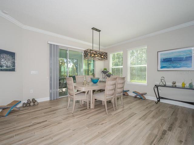 Dining room open to kitchen and living room. The adjacent den/office would also make a fabulous separate dining room.