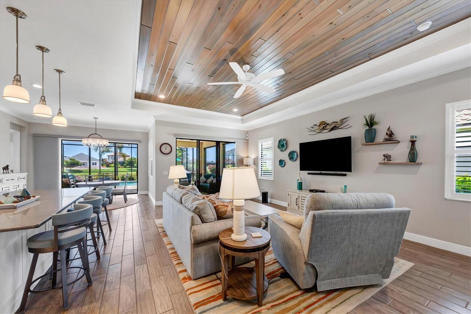 Great room with shiplap ceiling detail.