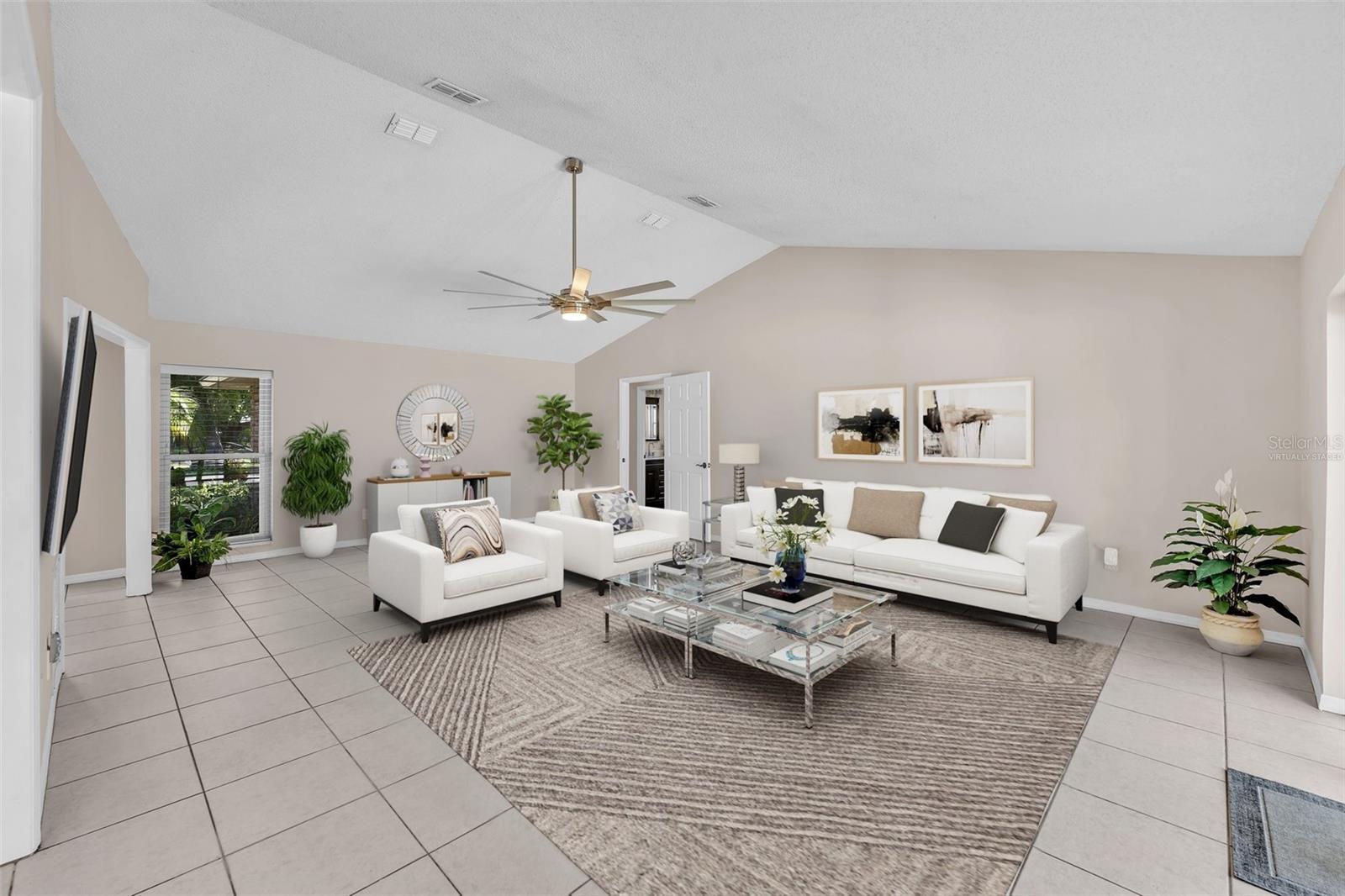 This photo was VIRTUALLY STAGED - Living Room &amp; Dining Room area