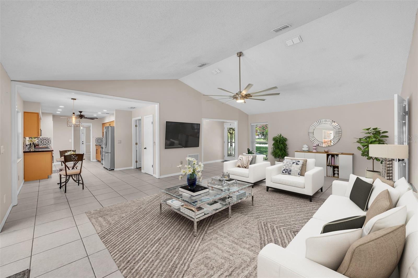 This photo was VIRTUALLY STAGED - Living Room &amp; Dining Room area