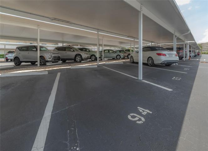 Carport parking spot conveys with unit