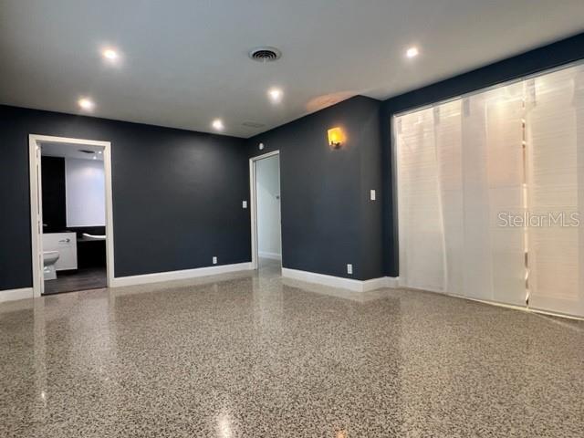 Mater BR looking toward bath on left and main door in center closet to right
