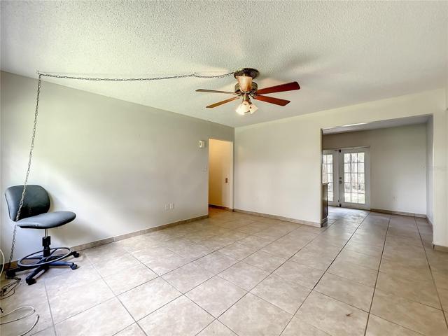 Unit 15: Living room with view into kitchen