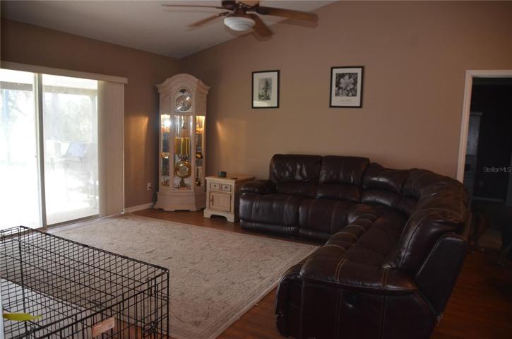 Great Room/Family Room Has Sliding Doors That Open To The Covered And Screened Pool