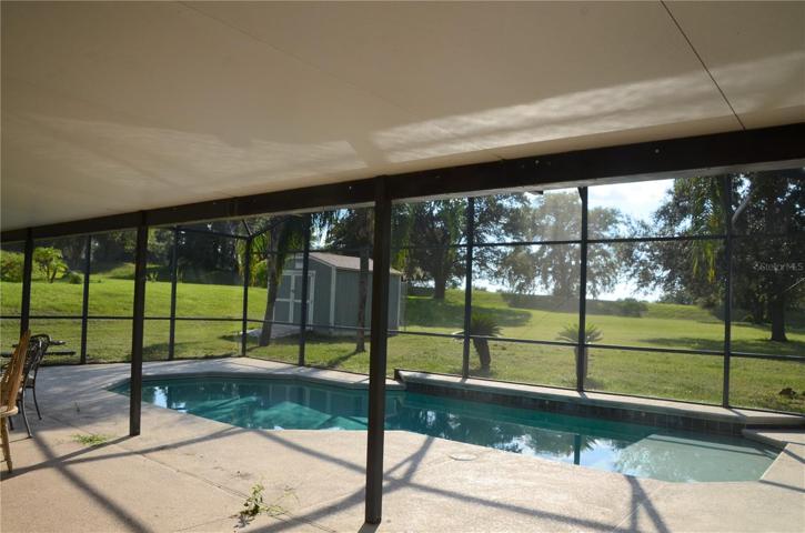 Covered Lanai/Pool With View Of Backyard Shed