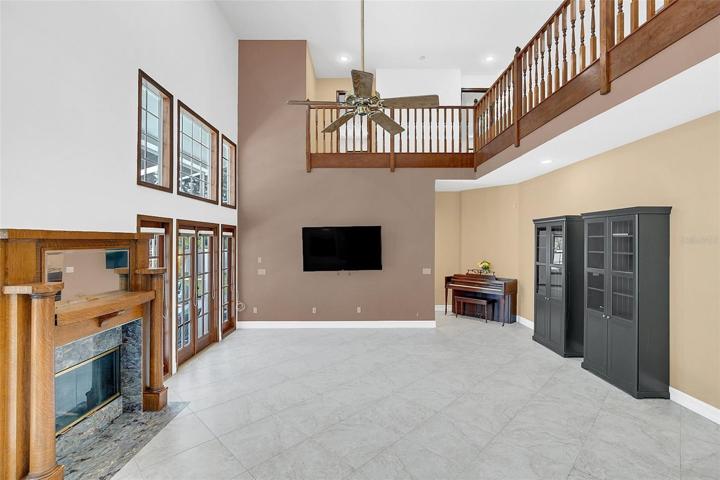 Great Rooms offers Media Center and fireplace