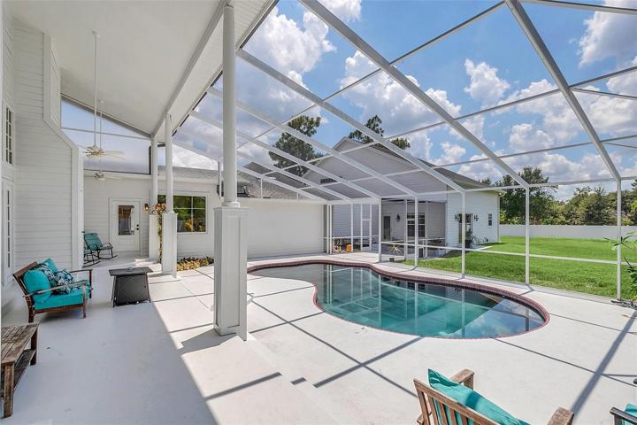 Spacious Covered Raised Porch and abundant Pool Deck