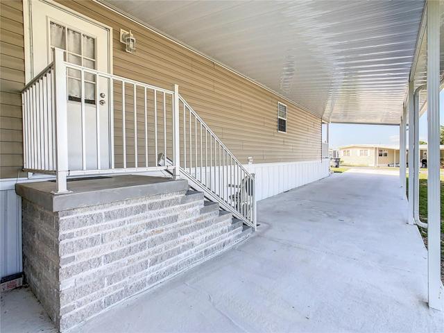 Side entrance and carport