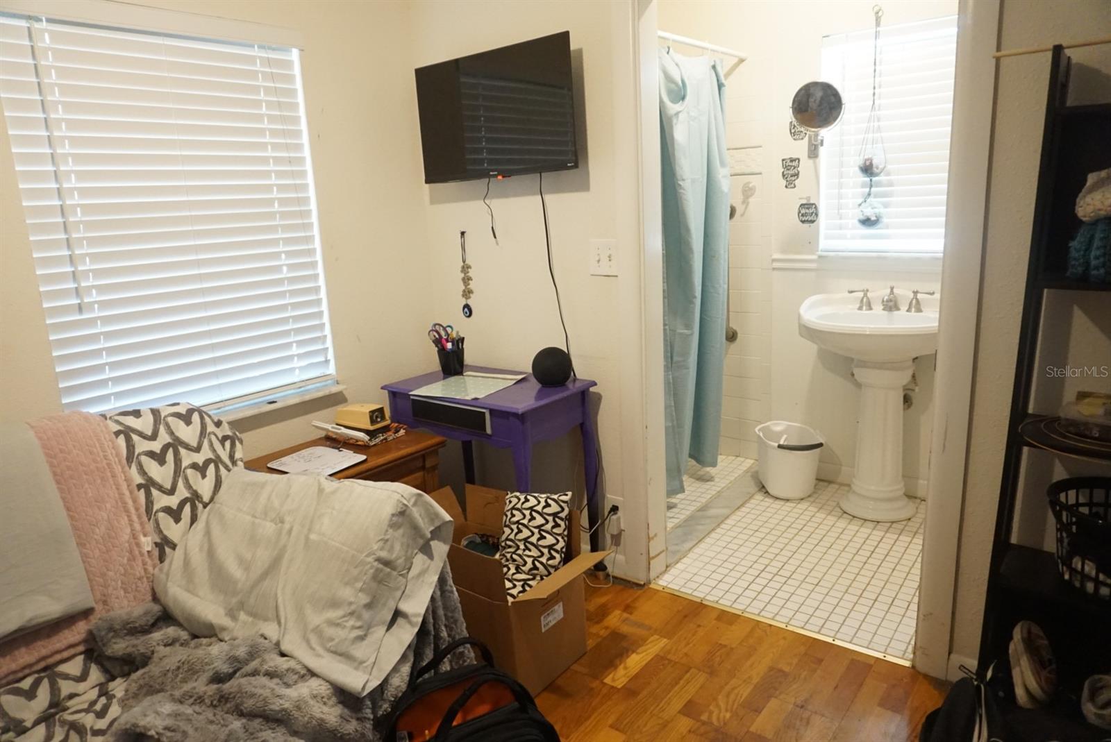Handicap accessible bedroom with bathroom.