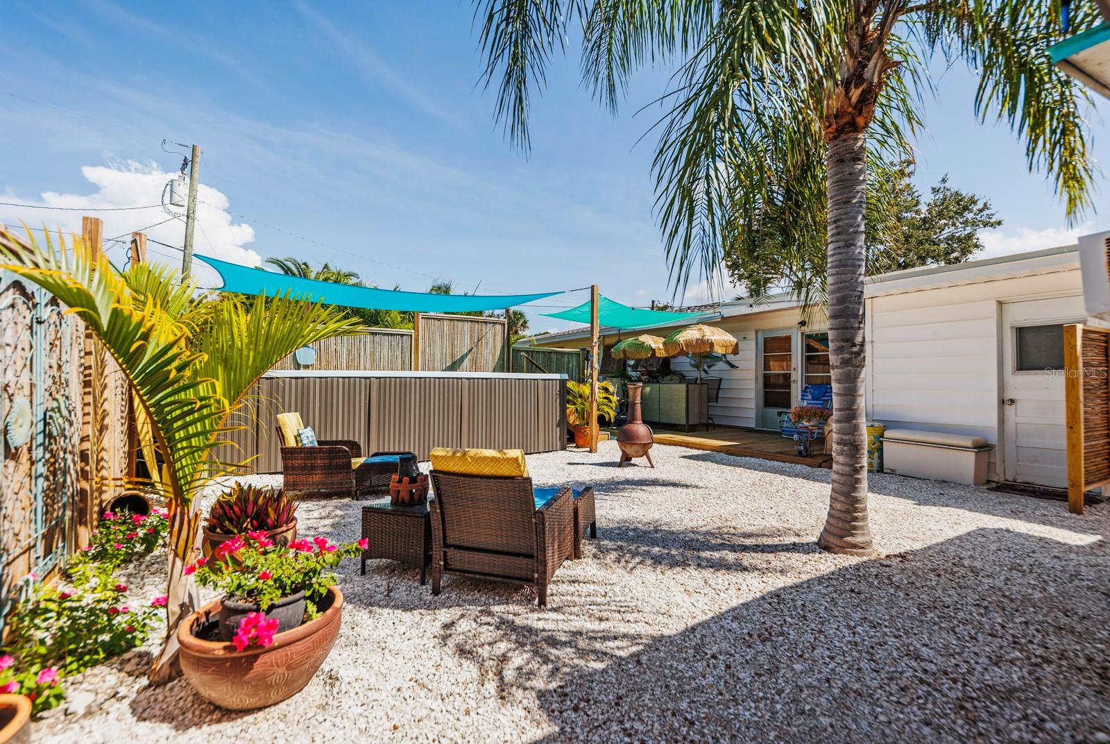 Private backyard oasis complete with a 9x16 swim spa!