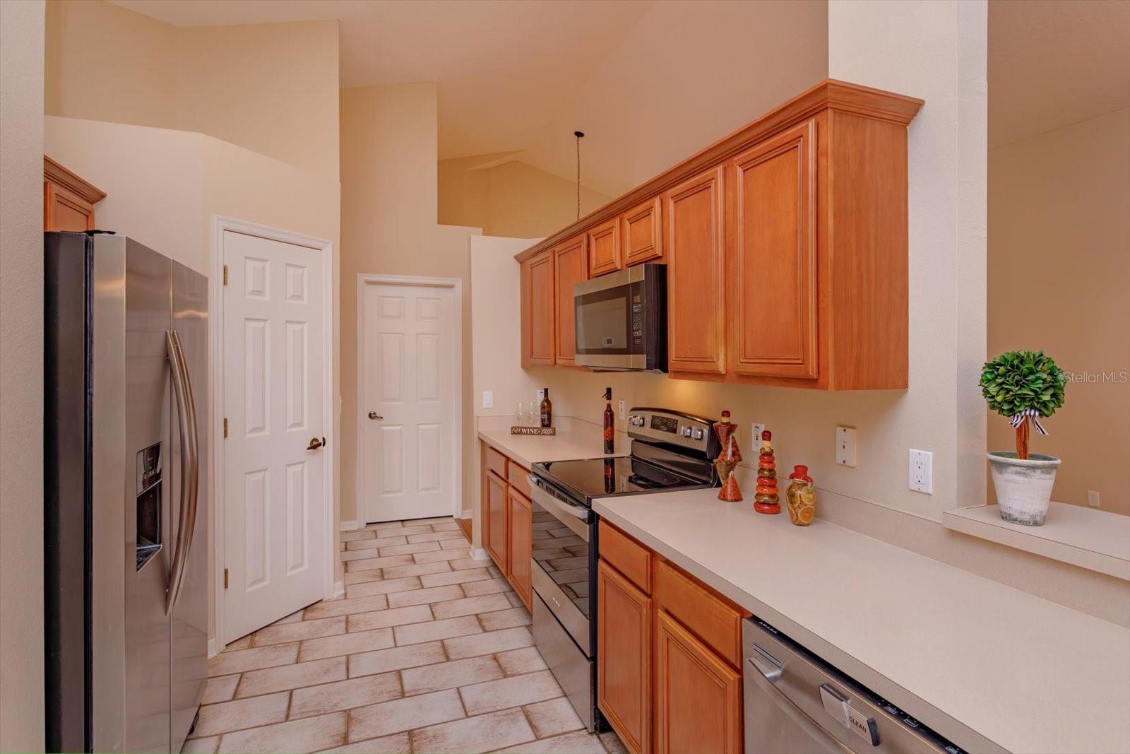 Maple cabinets and walk in panty