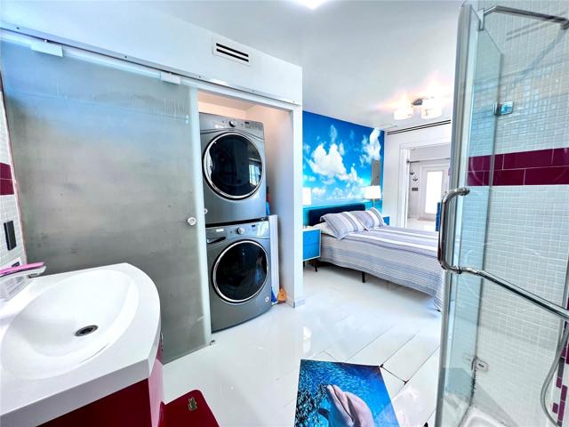 Stack washer and dryer in guest bedroom