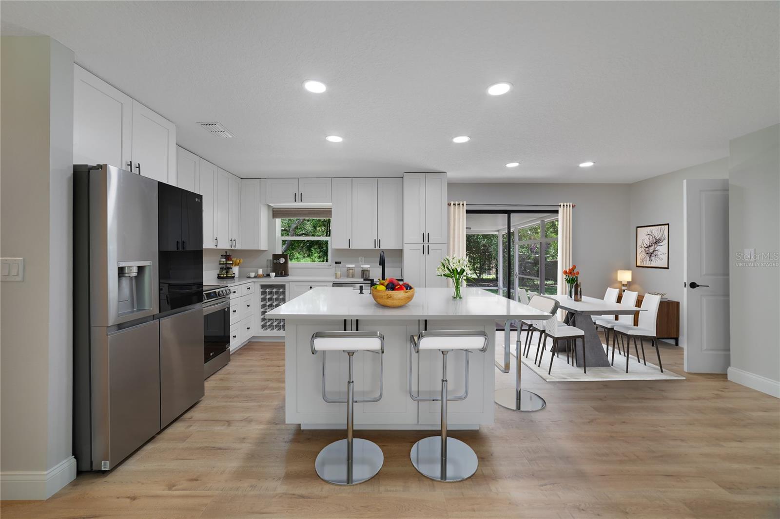 The family chef will appreciate the WOW factor of the kitchen while being fully equipped with UPGRADED STAINLESS STEEL APPLIANCES, plenty of storage and a large ISLAND with a farmhouse sink and bar seating for casual dining or entertaining! Virtually Staged.
