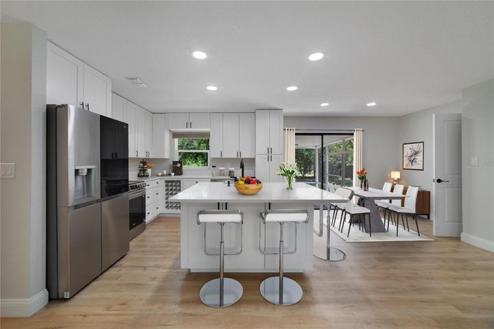 The family chef will appreciate the WOW factor of the kitchen while being fully equipped with UPGRADED STAINLESS STEEL APPLIANCES, plenty of storage and a large ISLAND with a farmhouse sink and bar seating for casual dining or entertaining! Virtually Staged.