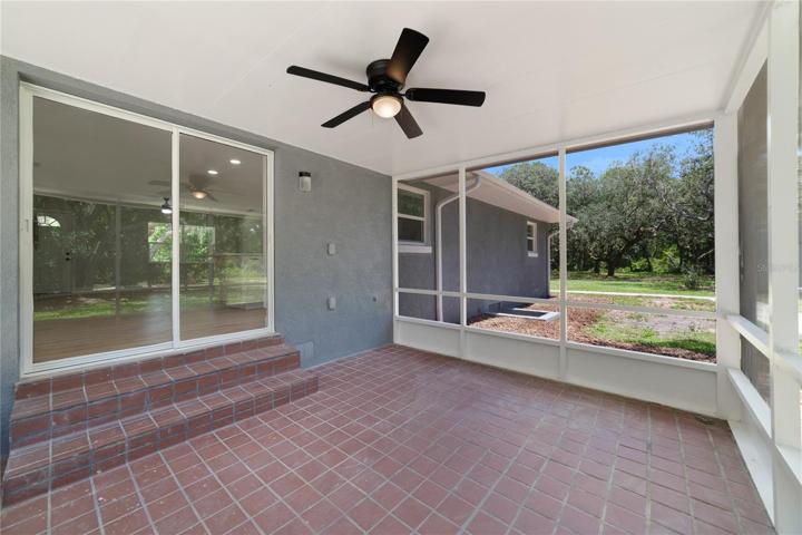 The SCREENED LANAI is the perfect place to enjoy the views this property delivers, a ceiling fan ensures comfort while you cookout with family and friends!
