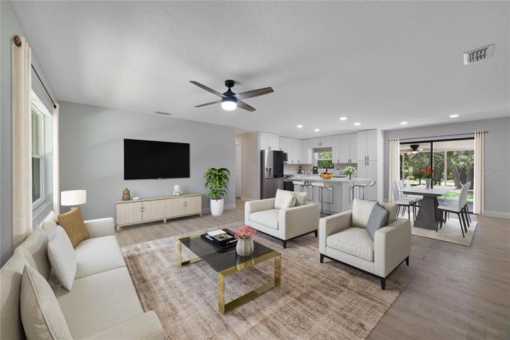 The OPEN CONCEPT feels light and bright from the moment you walk in the front door, the WOOD LAMINATE FLOORS and kitchen finishes have a fresh modern vibe. Virtually Staged.