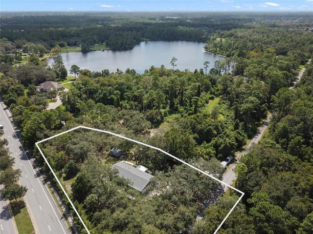 Tucked away between the entrances of the highly sought-after Live Oak Reserve Community and surrounded by million dollar plus lakefront homes on Lake Eva, this 3BD/2BA home sits surrounded by gorgeous Oak trees making 1.13 acres feel like 3 with the added benefit of NO HOA!