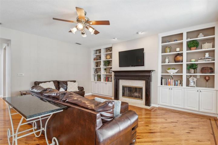 Wood-burning fireplace with custom built-ins.
